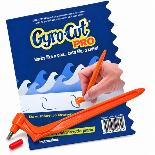 Gyro-Cut PRO swivel craft knife with its Standard blade and blade cap, in front of its packaging