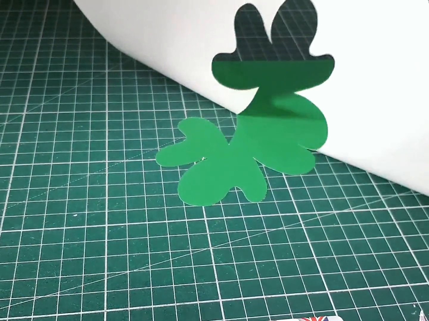 Real cut: the Gyro-Cut JNR cutting a clover shape in green card
